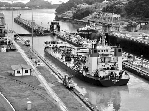 A ship navigating through one of the locks of the Panama Canal.