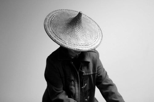 Cheng Yu Chiu wearing a Vietnamese hat