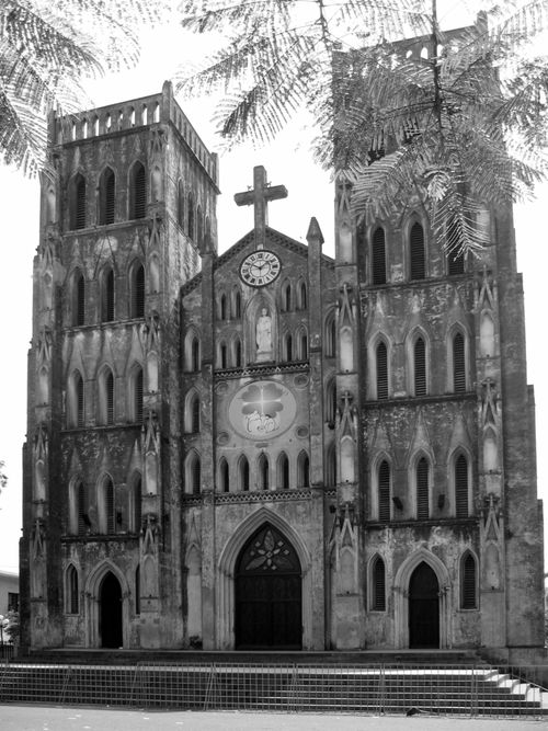 Exterior of St. Joseph Cathedral in Hanoi featuring two towers.
