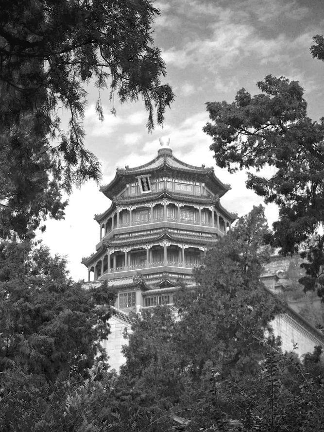 Looking at the Tower of Buddhist Incense through the trees at the Summer Palace in Beijing.