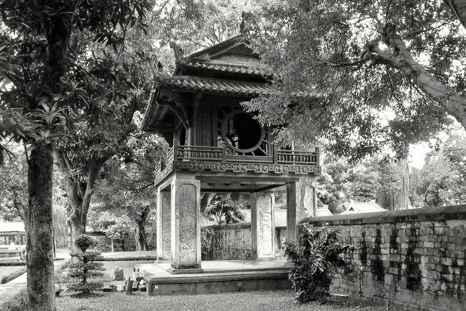 Temple of Literature in Hanoi, surrounded by trees and a wall.